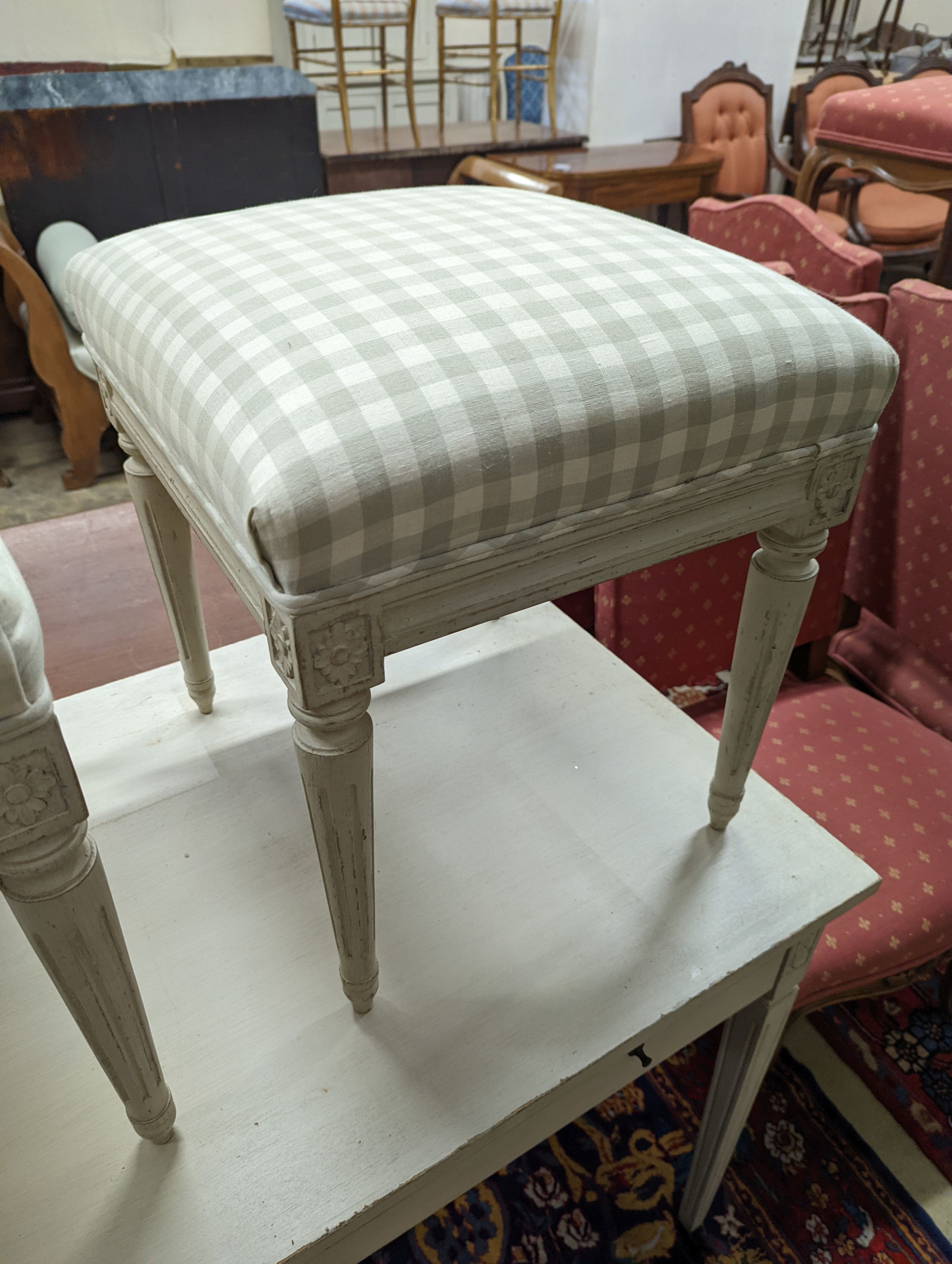 A rectangular painted dressing table, width 110cm, depth 60cm, height 75cm, together with two painted dressing stools